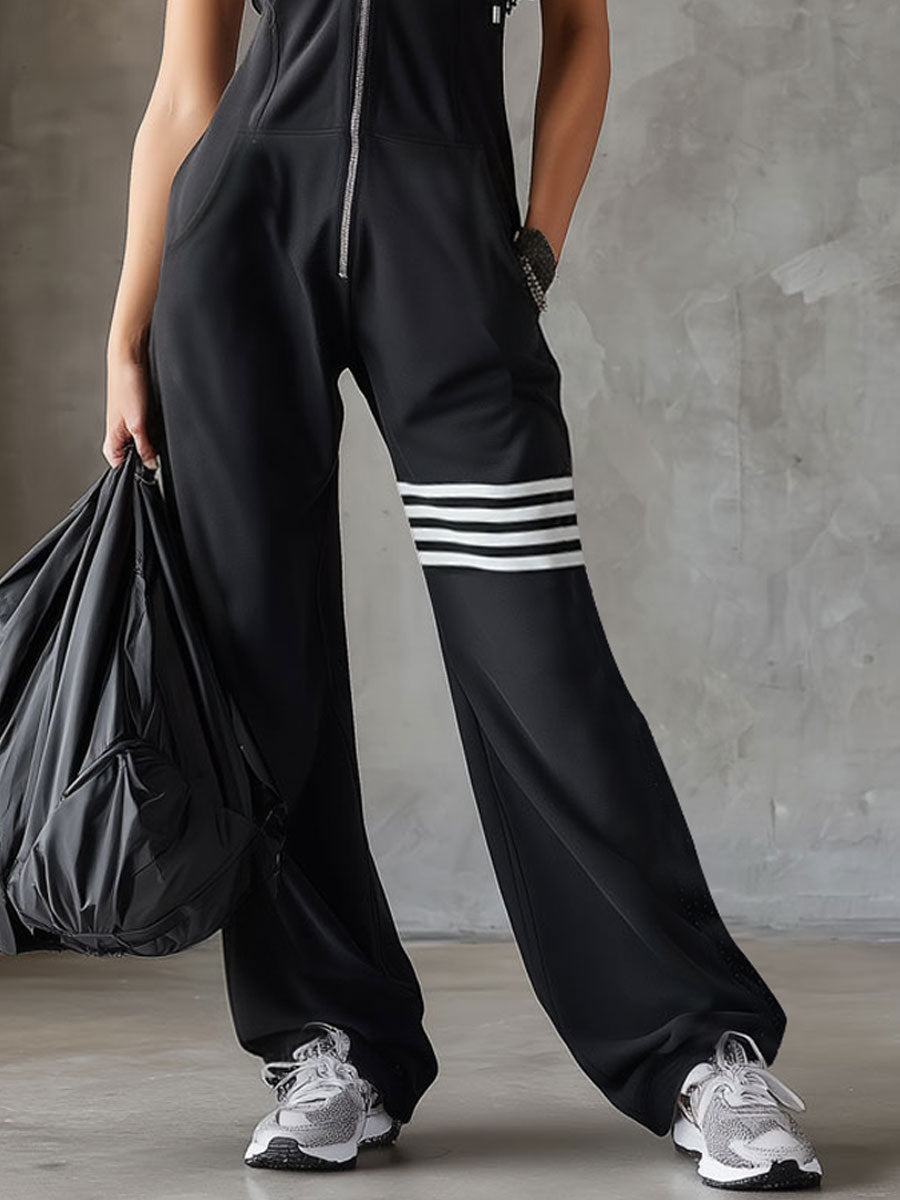 GOLDIE | SPORTY JUMPSUIT WITH HOOD AND ZIP